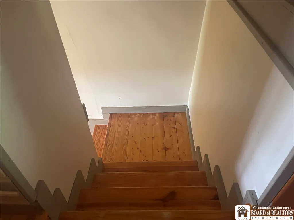 Stairs down from bedrooms - empty into living room