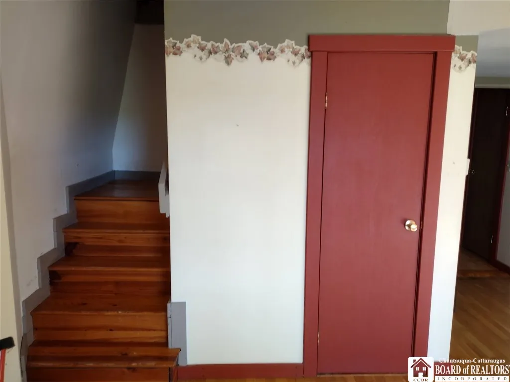 Closet in living room and stairs up