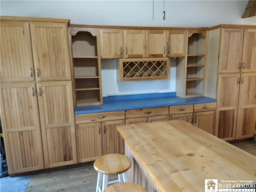 Hickory cabinetry in kitchen - island with eating area