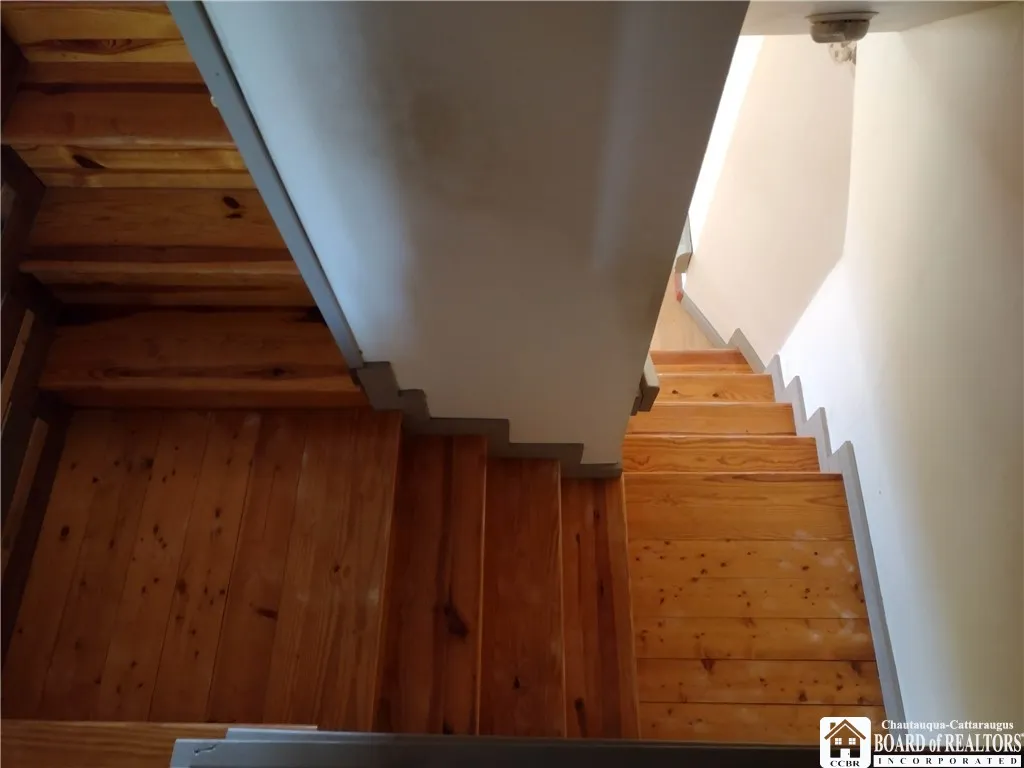 Stairs down from front bedroom to living room
