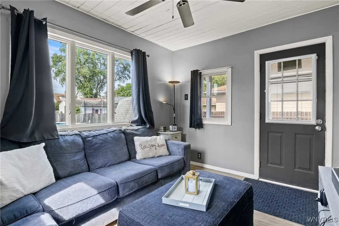 Additional Sitting Area That Could Easily Double As A Formal Dining Room That Leads Out To The Covered Back Porch