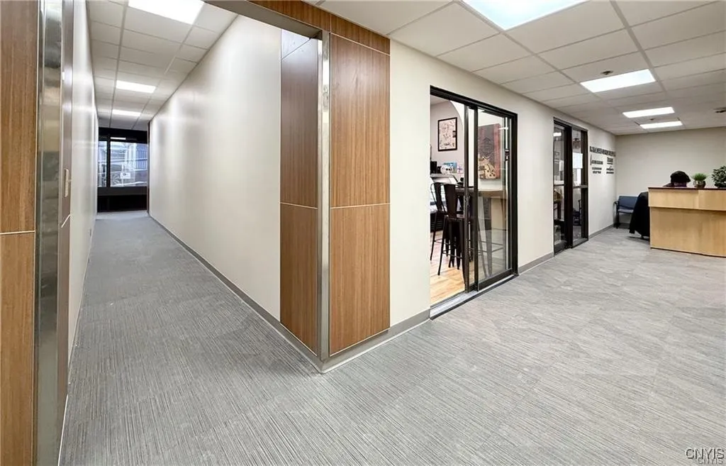 Hallway leading from the lobby entrance to the back entrance.