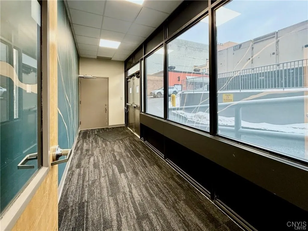 Alleyway entrance with two parking spots on an entrance/loading ramp.