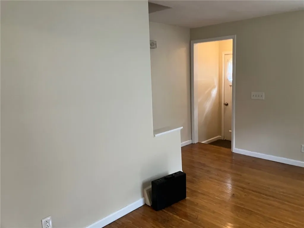 \nLarge living room with gleaming oak flooris.