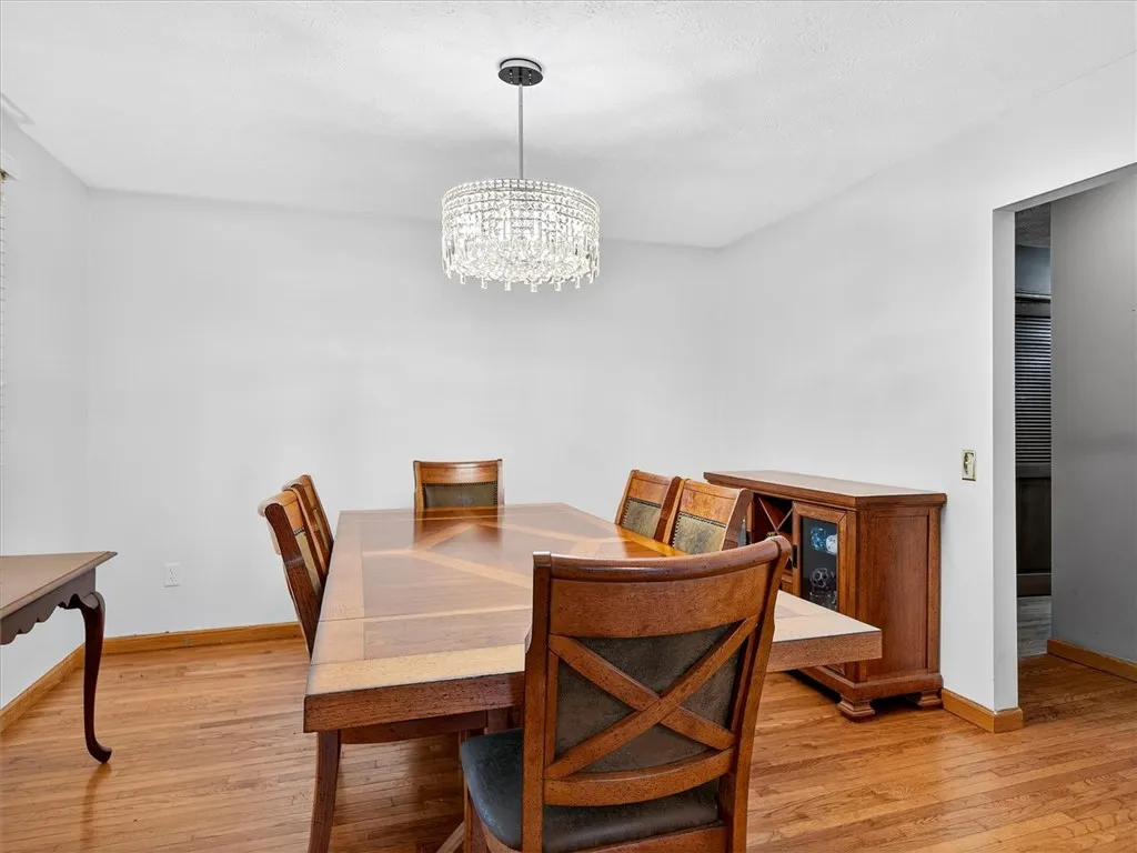 Formal Dining Room Opens To The Kitchen & Hallway To The Powder Room