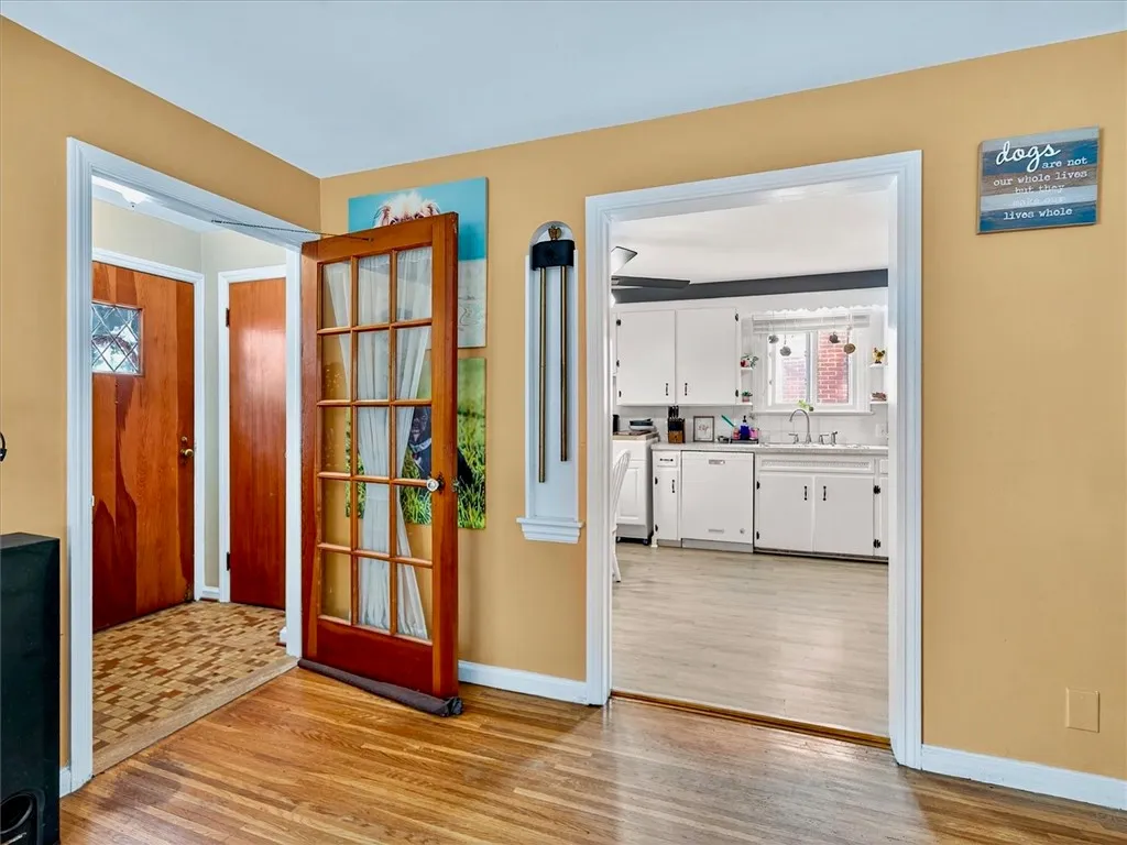 Great room with view of the front door and entry into the kitchen