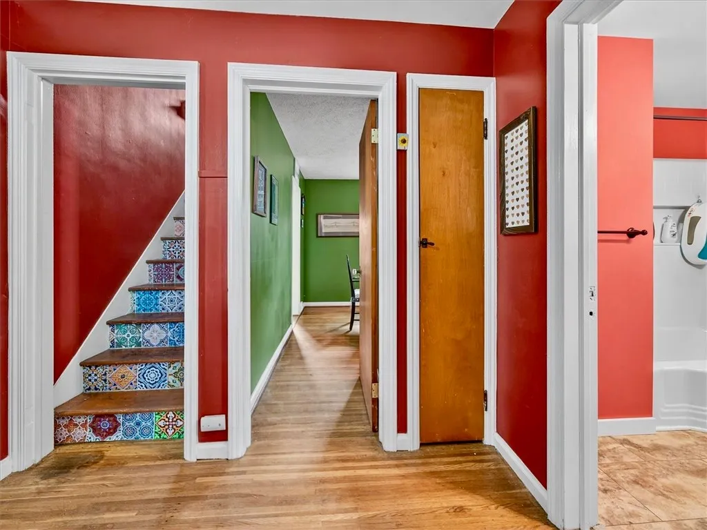 View of dining room (or 4th bedroom) entrance and stairs to the second floor