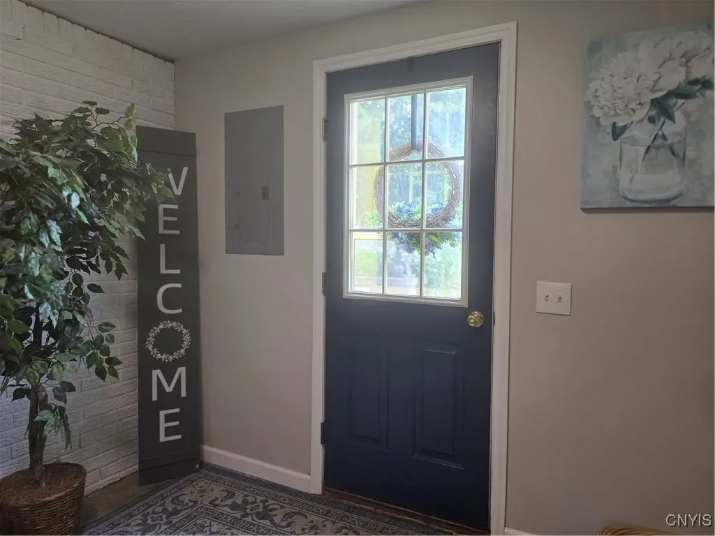 The real gem of this house---a HUGE mudroom/utility room..whatever you want or need room --welcoming all who enter and providing a place to take off their boots and hang their coats.