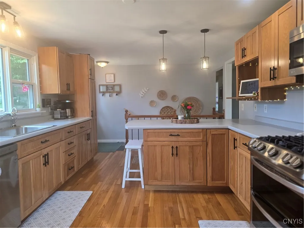 This kitchen is very nicely decorated, boasting an abundance of light and fabulous new stainless steel appliances.