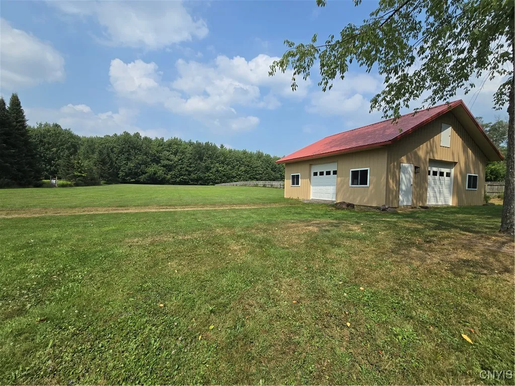 Another view of the barn. There is an overhead door on three sides of the barn...and just look at that landscape..just beautiful!