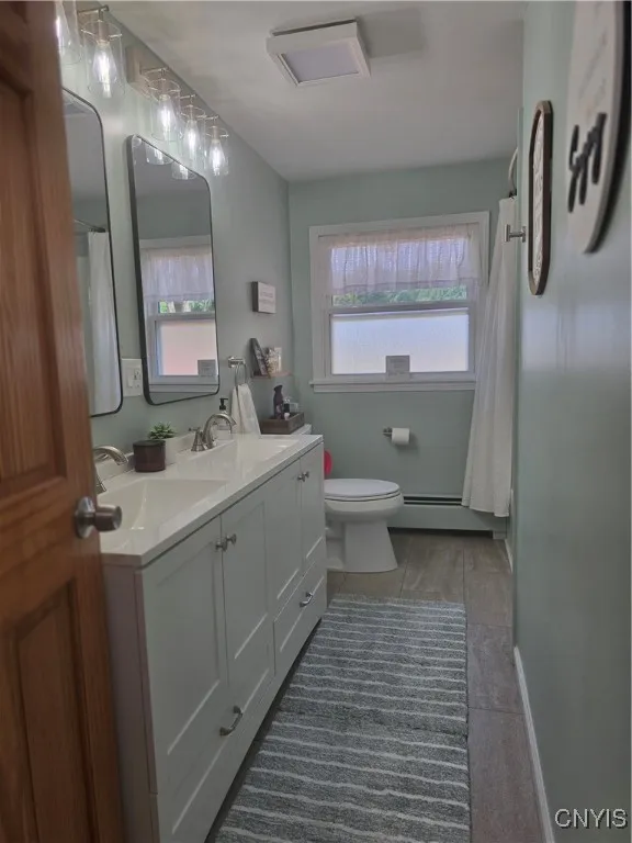 The main bathroom has been TOTALLY REMODELED. Again, very relaxing tones, beautiful double vanities, double mirrors, lighting..EVERYTHING IS NEW!! **There is another full bath in the basement.