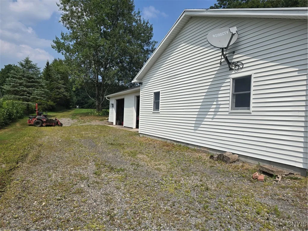 This is a view of the garages. The 2 in the front face the road. Then, the other 2 are behind the first 2 and their doors face the side of the lot. **Note: the 2 garages (4 spaces plus) are open to each other inside.