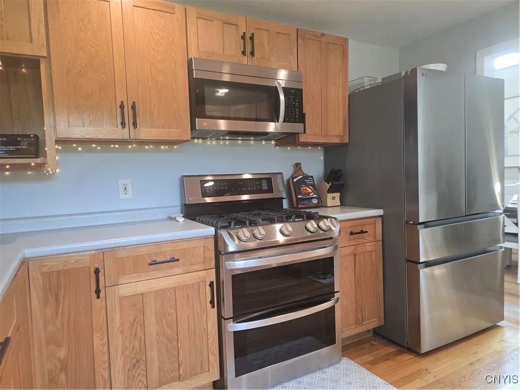 Here's a closer look at the new stainless refrigerator and gas stove with double ovens.