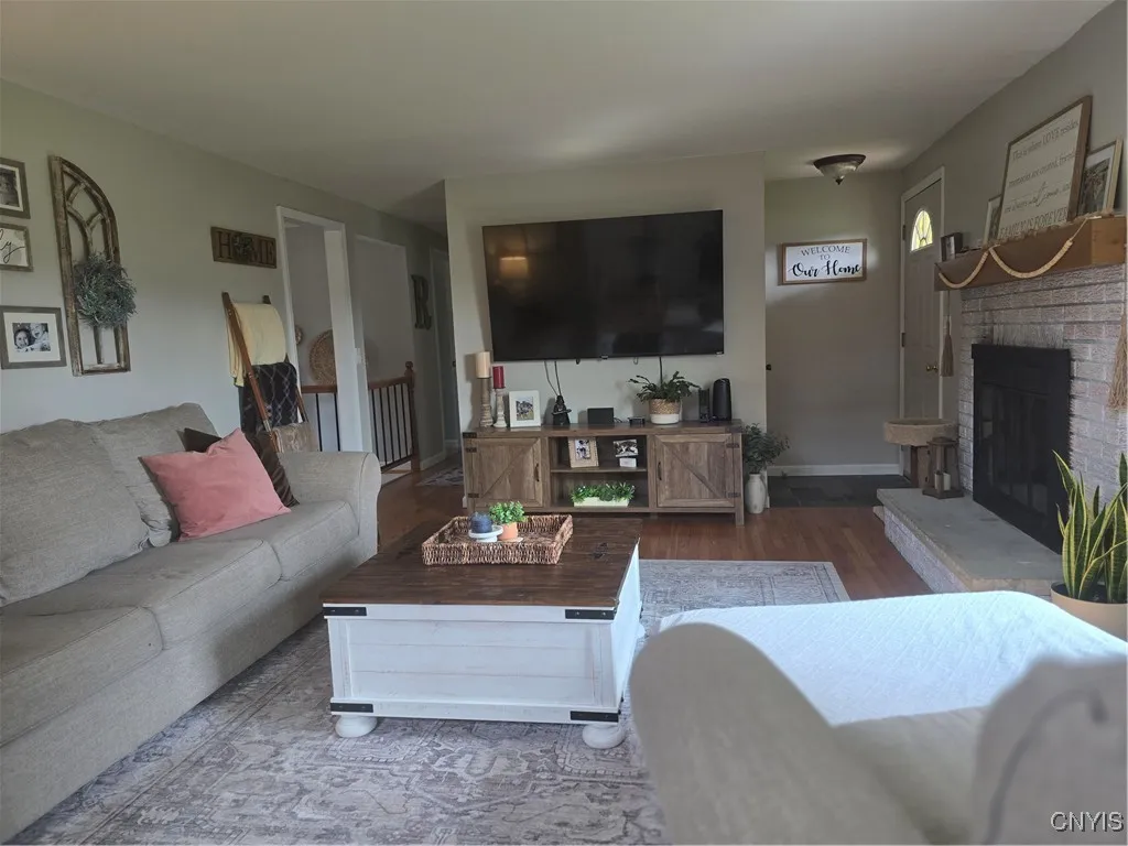 The family/living room is very tastefully decorated and very welcoming. From this angle, the open railing is highlighted.