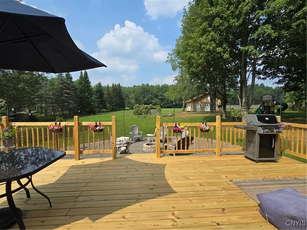 The FABULOUS, HUGE NEW DECK!! Perfect for entertaining & relaxing. As you can see, this is your own little retreat...peaceful, tranquil, lovely...overlooking the yard and fire pit...perfect for a night of S'mores !!!
