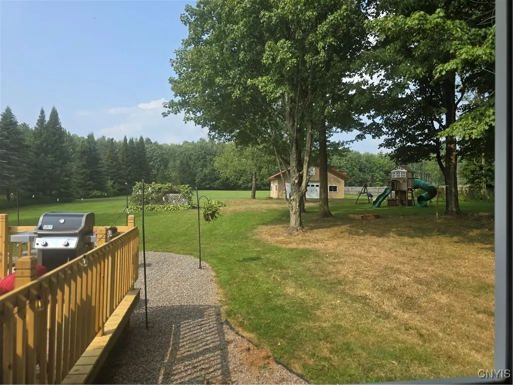 Here's another view of the yard..notice the barn and play yard to the right.