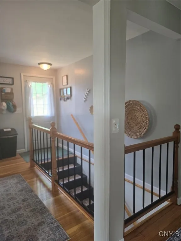 Another view of the newly remodeled stairs, leading to the new storm door, leading to the deck and yard.