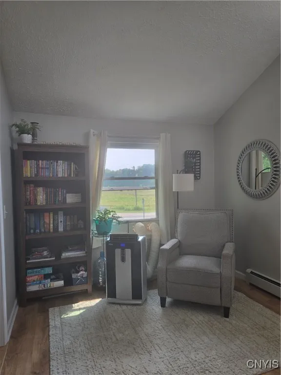 The dining room is so spacious, that even with a large table and several chairs, there's still room for a sitting/reading room at the one end.