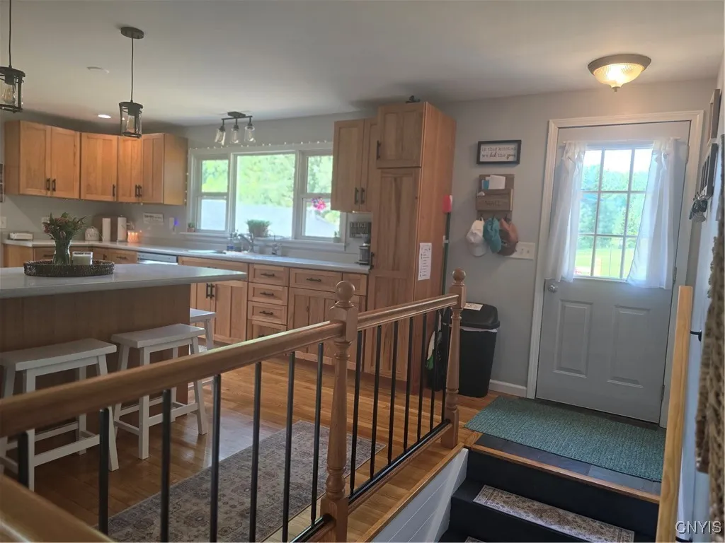 While we're on the topic of efficiency, this kitchen is VERY efficient with it's breakfast bar on one side and formal dining room on the other. The door opens to a HUGE deck--perfect for entertaining!