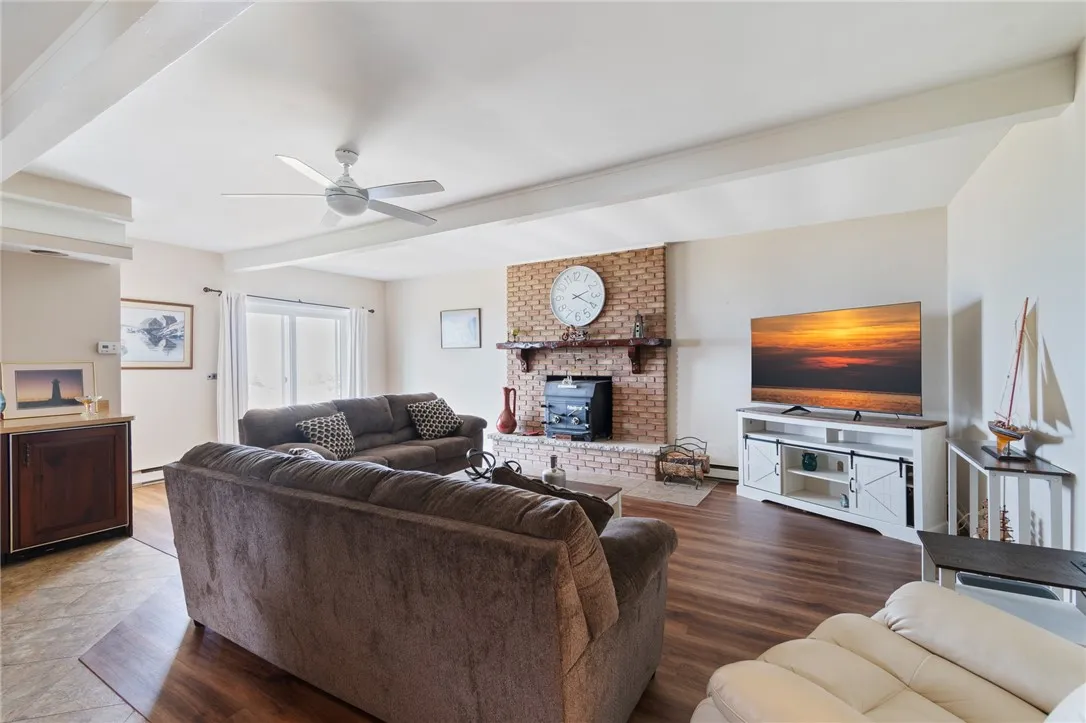 The HUGE FAMILY ROOM with beautiful views of the waterfront from the slider that leads to the patio