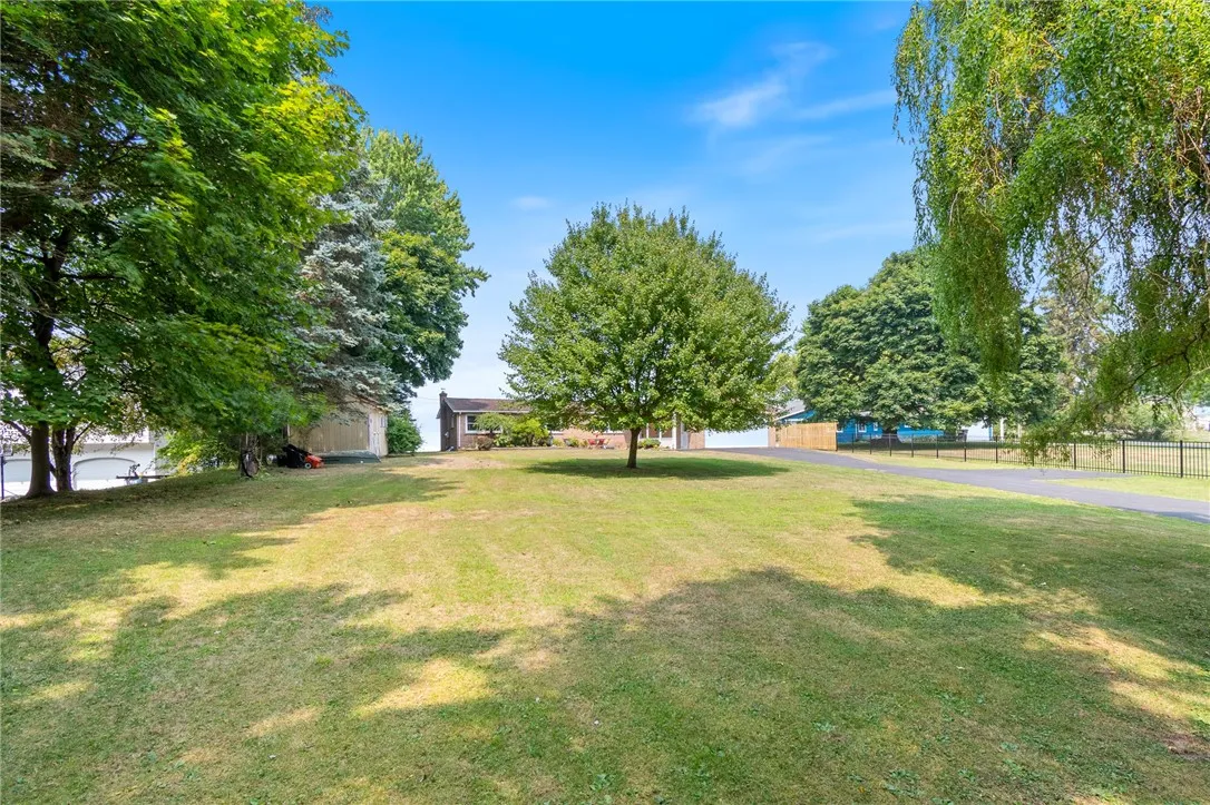 The view from the road (it’s a dead end so very little through traffic!) sits WAAAY BACK from Lake St