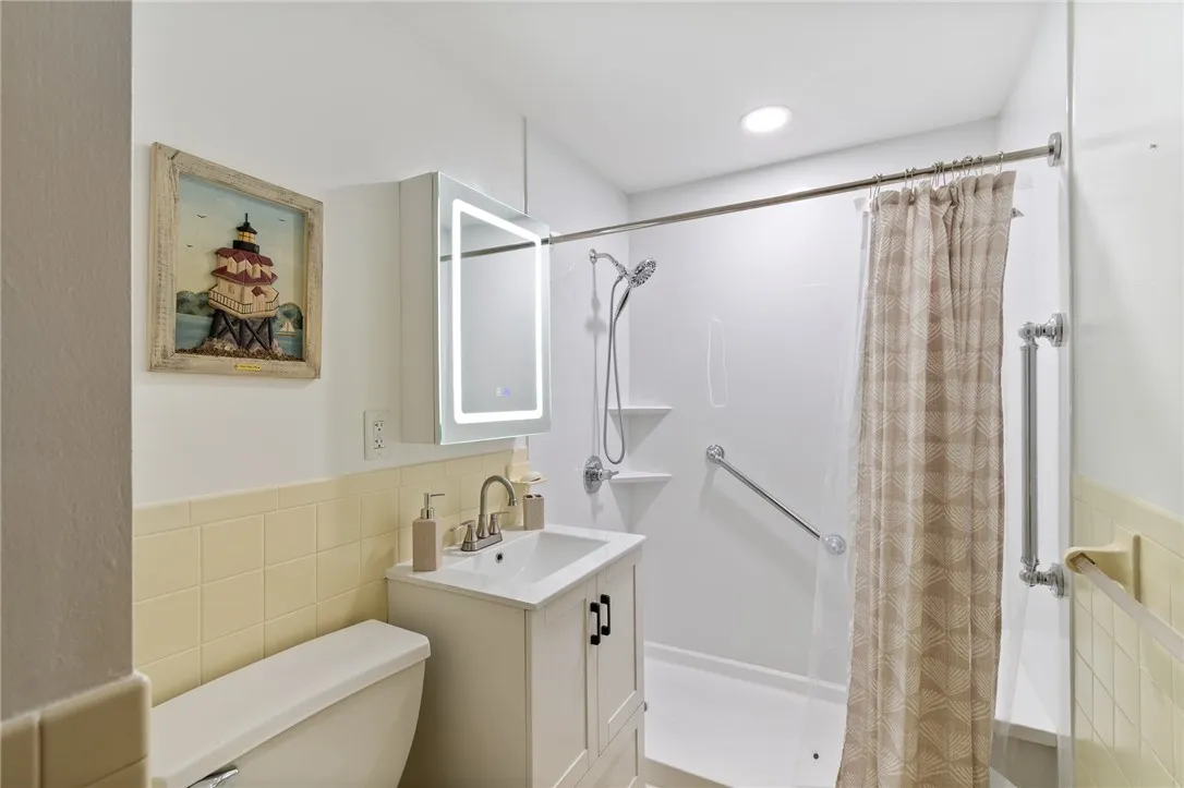 The recently remodeled FULL BATH in this ranch style home - there’s another in the full basement too!