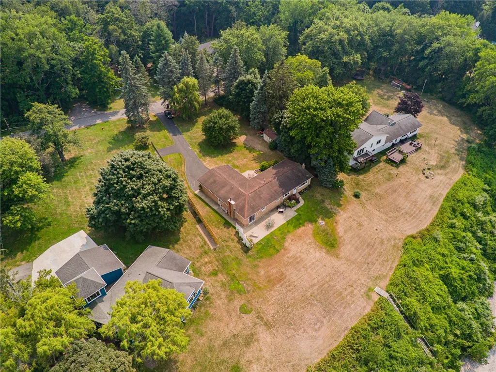 The yard is impeccably maintained! There’s even a privacy fence! This view shows the stairs to the waterfront