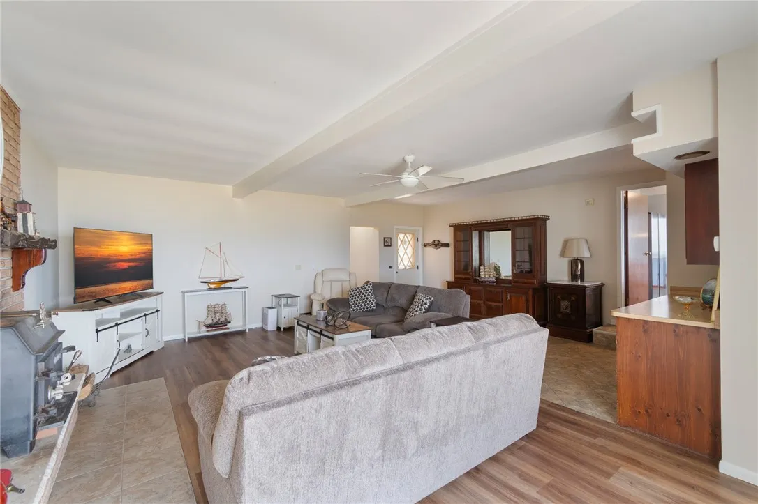 The family room- this room is HUGE! There is even a built-in bar/refrigerator area for ALL YOUR ENTERTAINMENT NEEDS! Easy care flooring too!