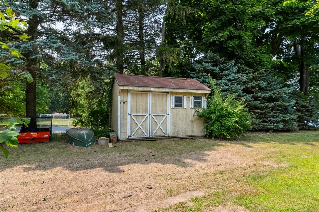 A shed - for all the garden tools to take care of the beautiful landscaping at this coveted location!