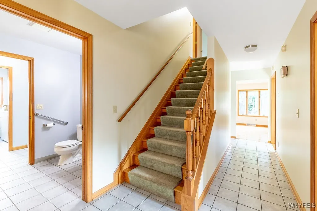 Second floor staircase and Half bath of main hallway.