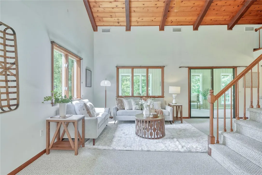 Open & Airy family Room with Vaulted wood-paneled ceilings!
