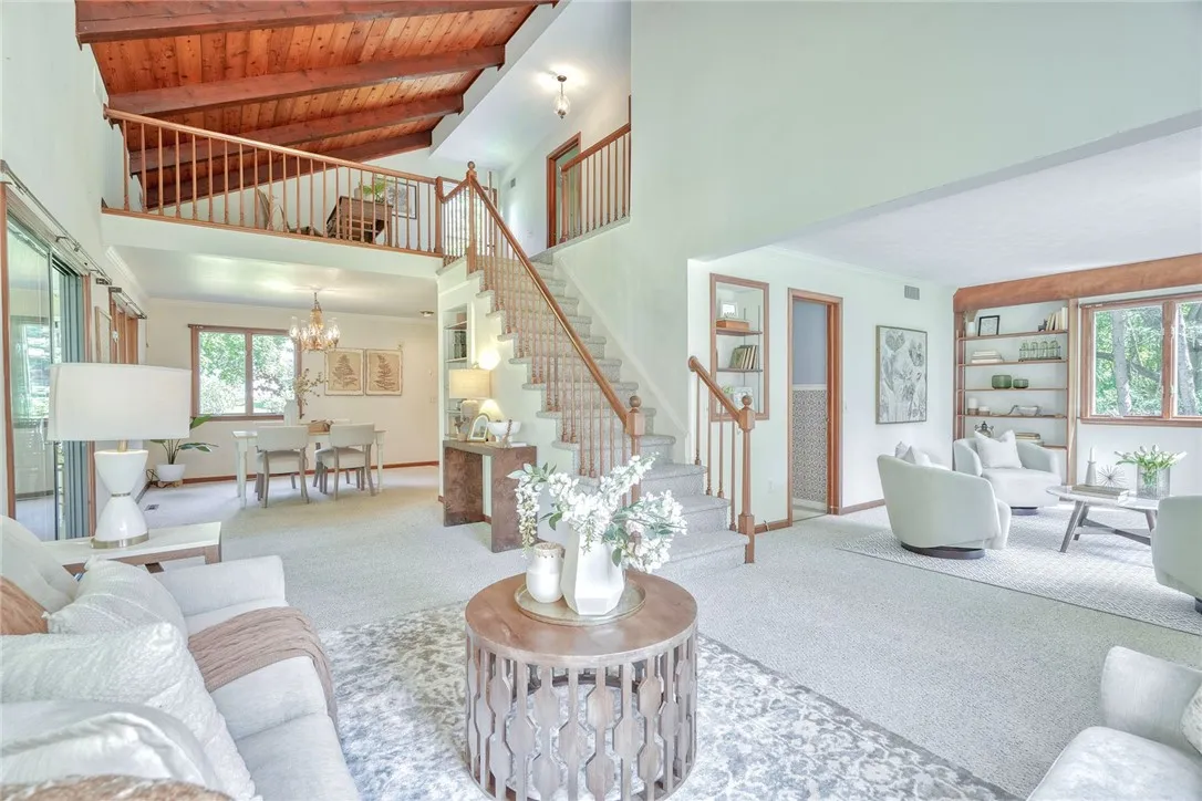 Open & Airy family Room with Vaulted wood-paneled ceilings!