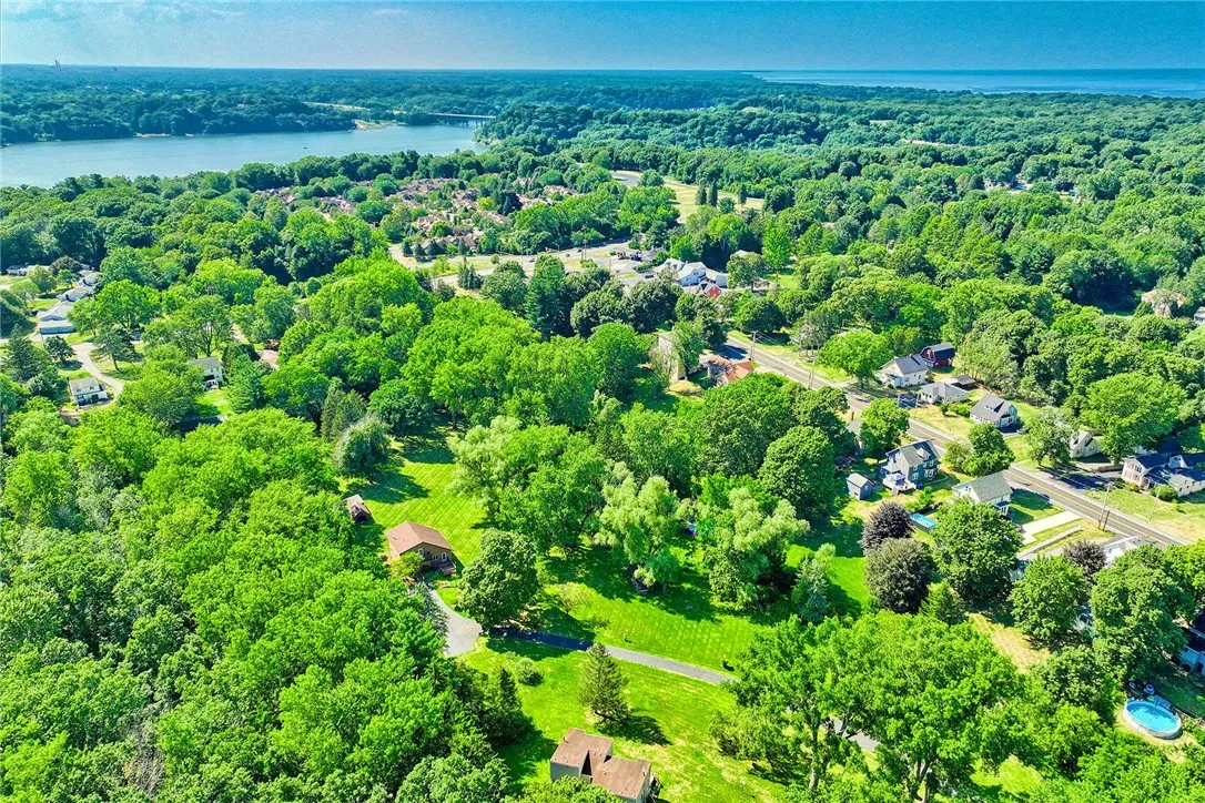 overhead view showing off the irondequoit bay bridge and lake ontario.
