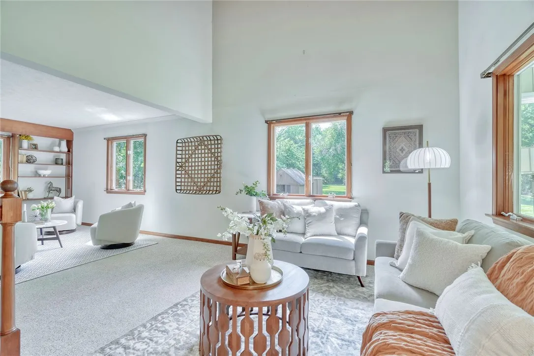 Open & Airy family Room with Vaulted wood-paneled ceilings!