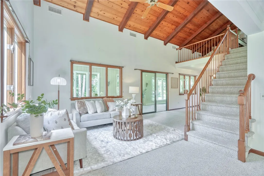 Open & Airy family Room with Vaulted wood-paneled ceilings!
