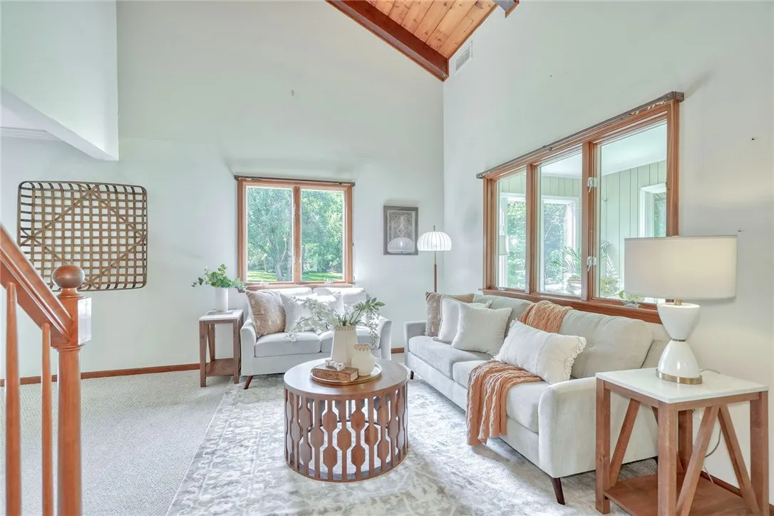 Open & Airy family Room with Vaulted wood-paneled ceilings!