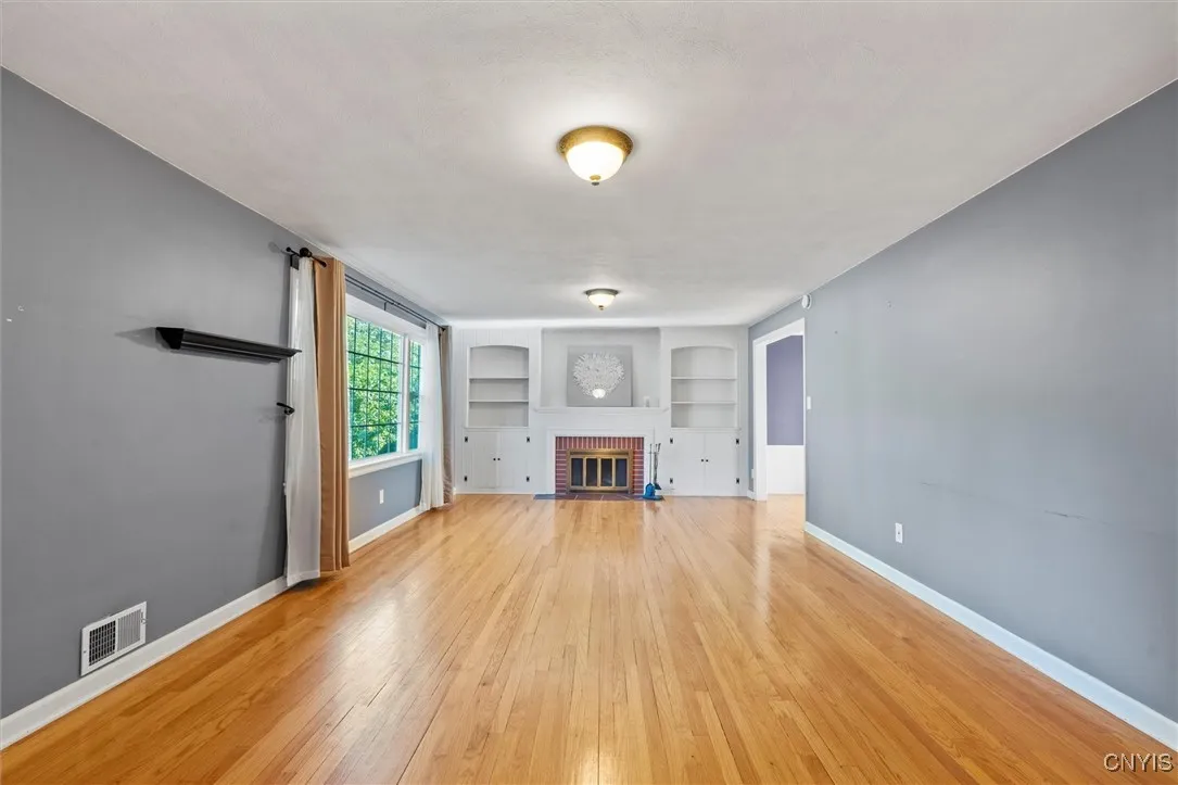 wood burning fireplace with built in book shelves