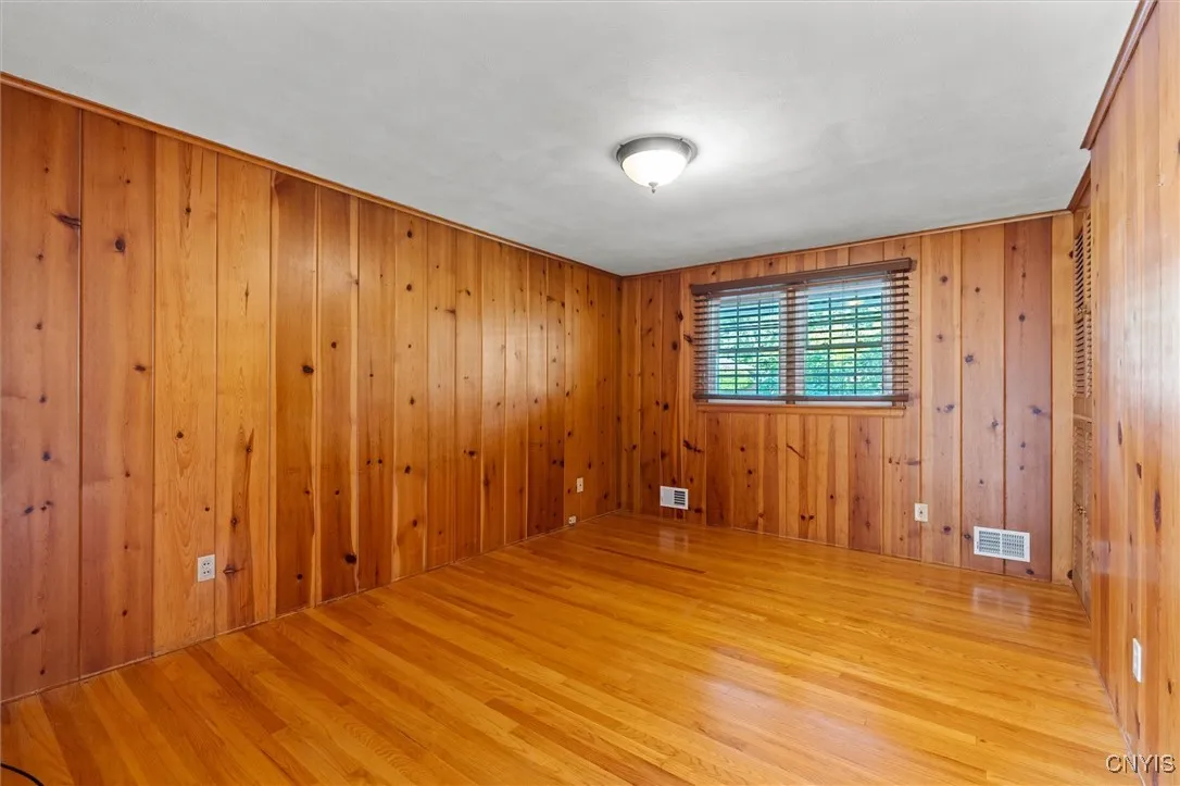 original pine paneling with refinished hardwood floors