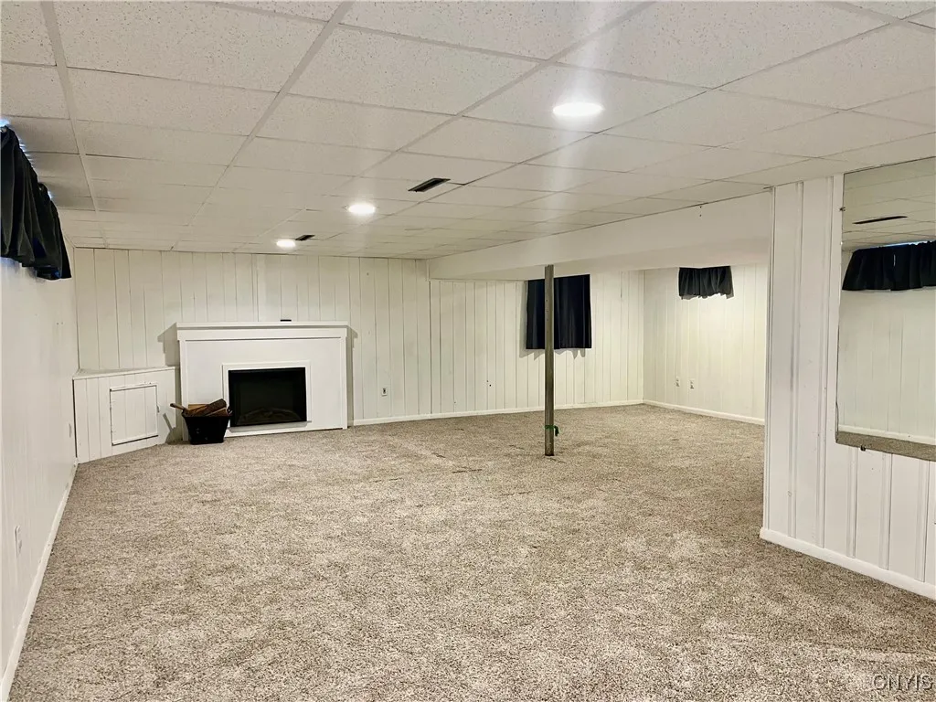 finished lower level includes electric fire place and built ins