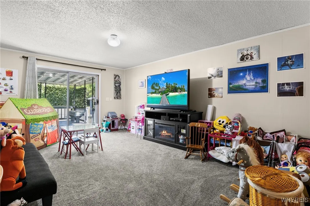 3rd Bedroom w/ Sliding Glass Doors Leading out to Covered Back Deck with His/Hers Closets