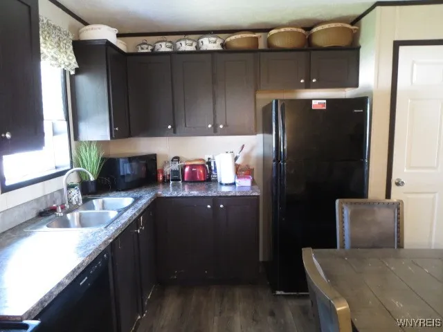 Kitchen with dishwasher, stove & refrigerator  included...as is.