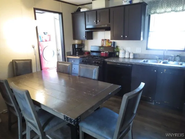 Kitchen with plenty of cabinet space....Laundry room off the kitchen **EXCLUDE WASHER & DRYER**