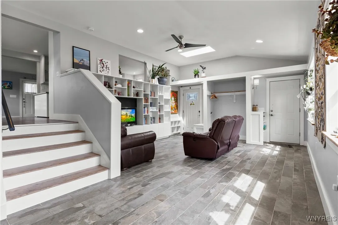 Enter into this bright and spacious family room from either the entry door or the garage door. Walk up 5 stairs to enter into the kitchen (2nd floor) Enter into this bright and spacious family room from either the entry door or the garage door. Walk up 5 stairs to enter into the kitchen (2nd floor)