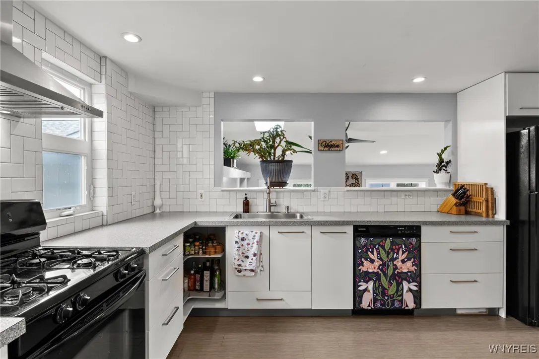 Kitchen view from walk-pantry showing openings looking down into family room, to add to the open floor plan between the two floors. Kitchen view from walk-pantry showing openings looking down into family room, to add to the open floor plan between the two floors.