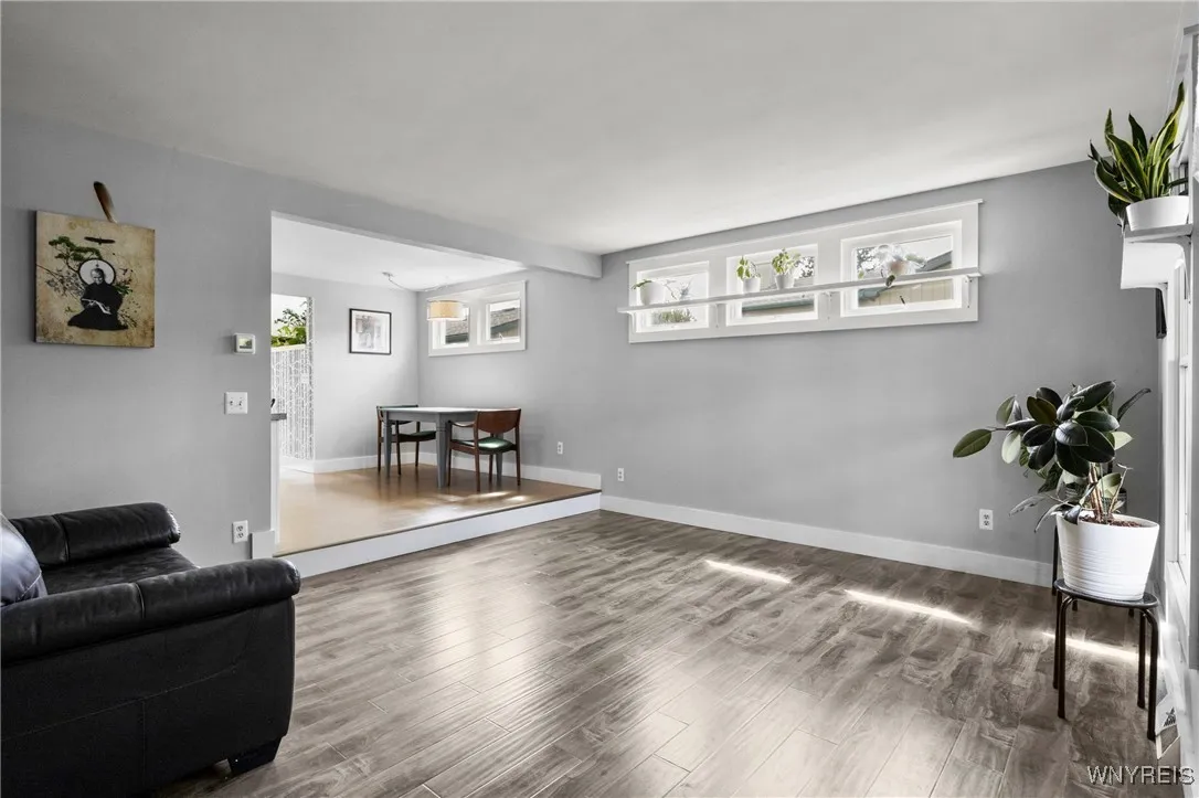 Living room looking into kitchen area. This space could be used as a forma dining area or something else? Living room looking into kitchen area. This space could be used as a forma dining area or something else?