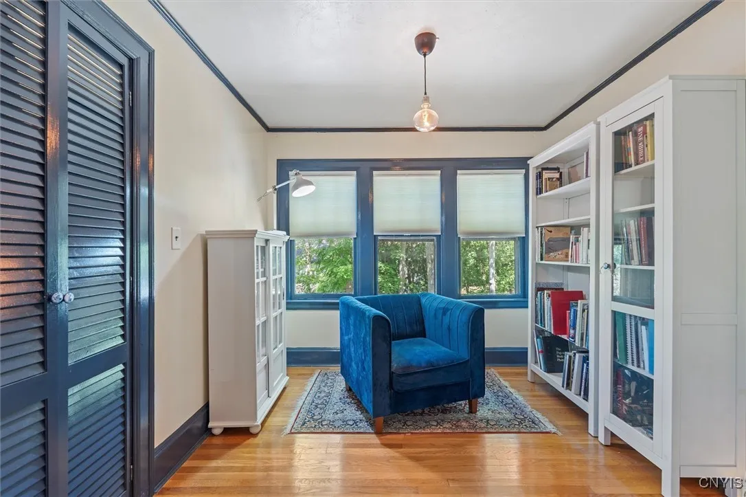 Primary sitting room with walk-in closet