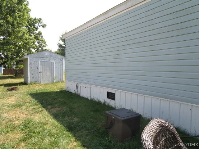 Side view with shed for all your outdoor gardening tools!