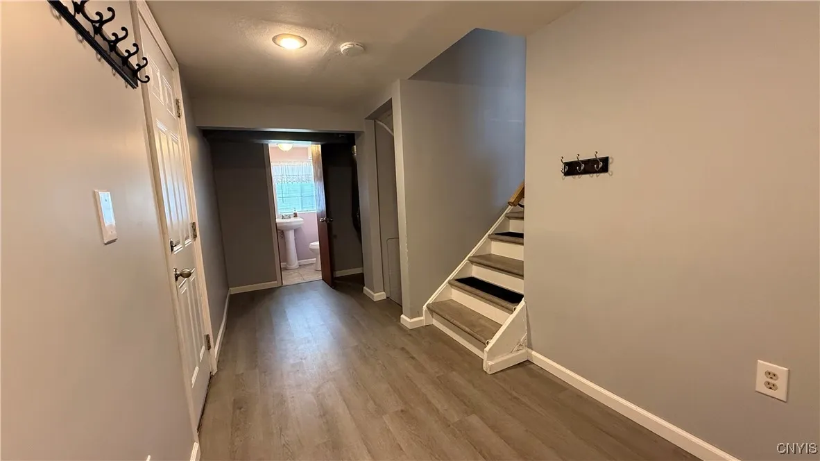 Lower Foyer - new luxury vinyl flooring and drywall