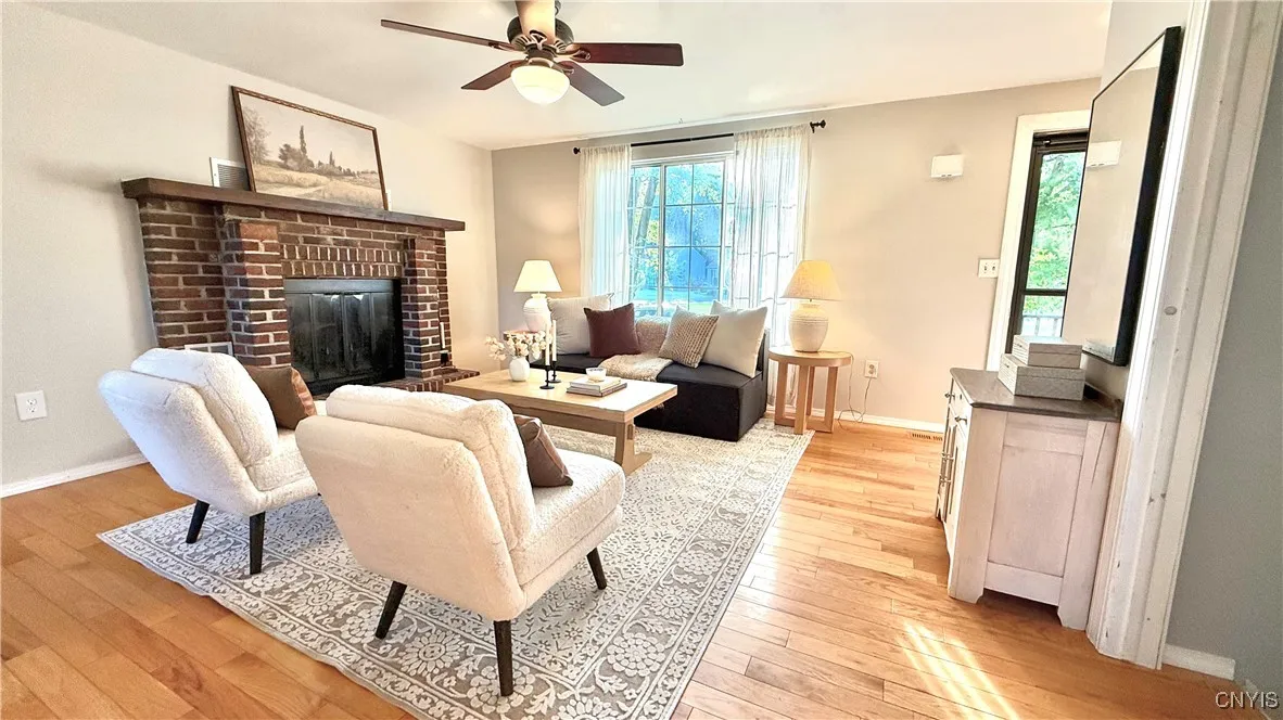 Living room with a wood-burning fireplace. This room was just painted.