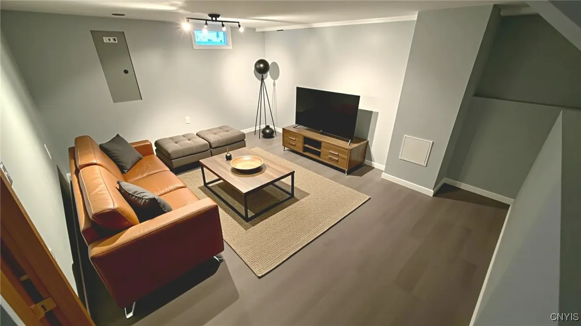 Virtually staged finished basement - meant for illustrative purposes only. Actual room is unfurnished.